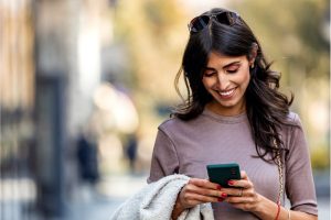 what is a personal checking account - woman using phone