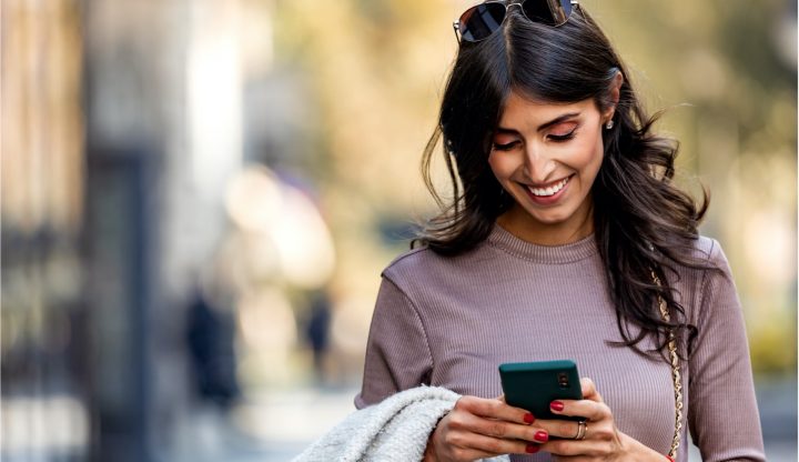 what is a personal checking account - woman using phone