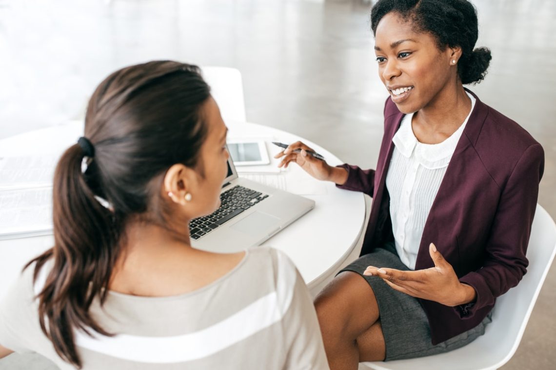 Woman talking to banker about certificates of deposit