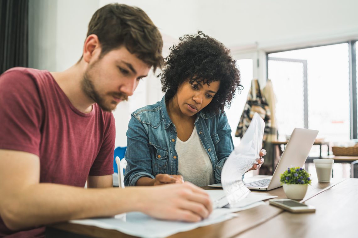 Couple calculating what they can afford