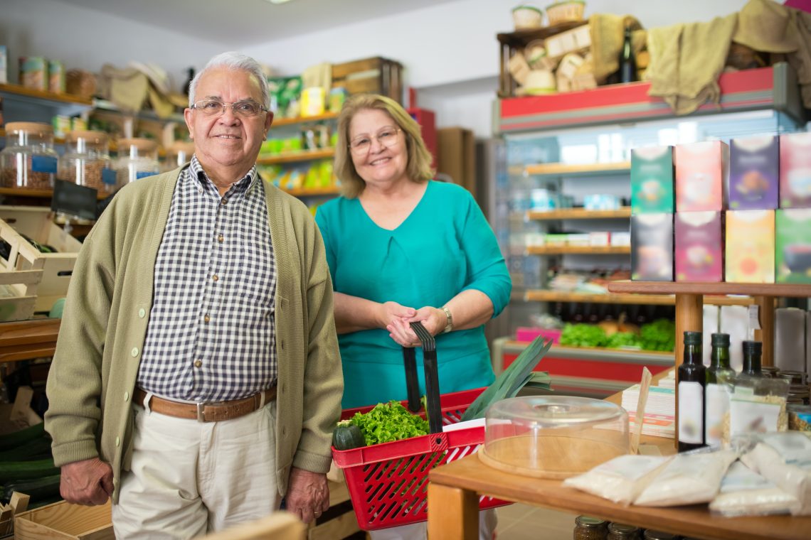 Older couple shopping with Kasasa Cash debit card