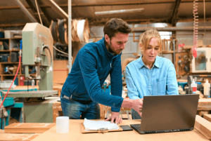 Carpenters reviewing 7a loan on their computer
