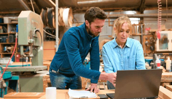 Carpenters reviewing 7a loan on their computer