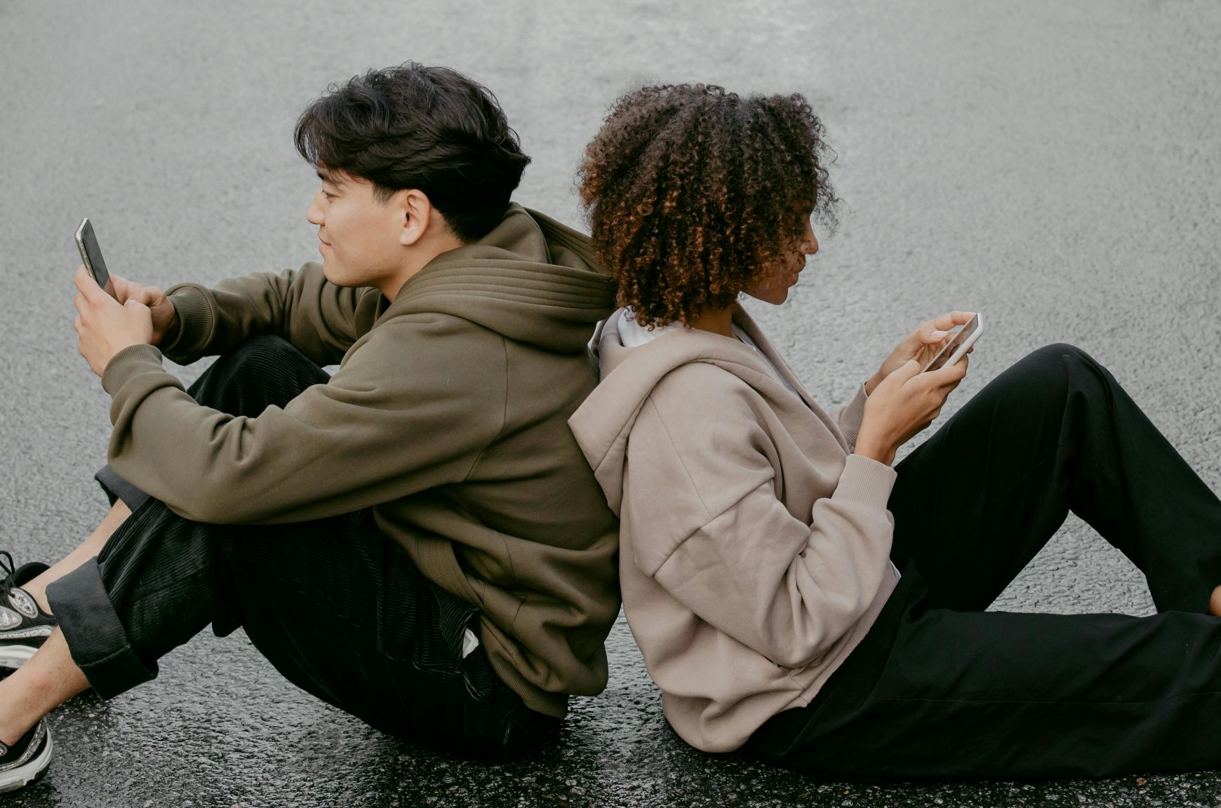 two people using mobile phones