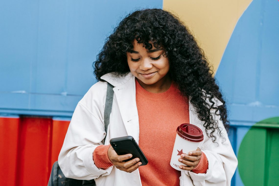 girl on phone colorful background